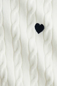 Chandail en tricot torsadé