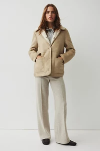 Pantalon en maille côtelée avec plis