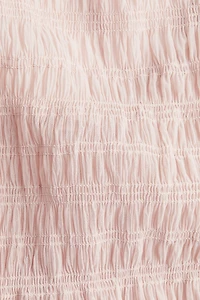 Smocked Peplum Top