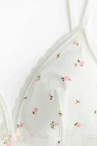 Soutien-gorge souple et coussiné en pointelle