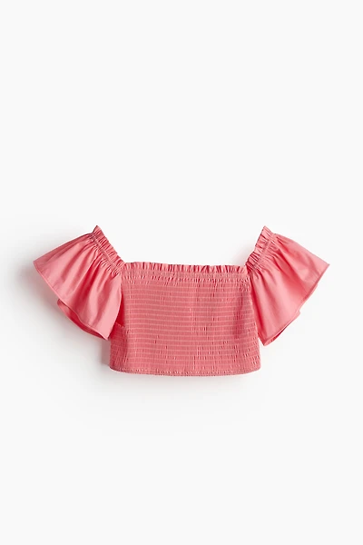 Haut court avec smocks