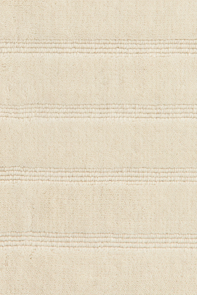 Grand tapis tissé à la main en laine mélangée