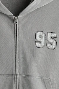 Veste kangourou carrée ample à fermeture éclair