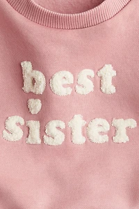 Chandail avec appliqués en tissu éponge