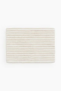 Tapis de bain en coton touffeté