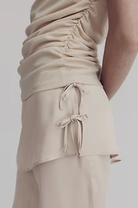 Pantalon en satin avec jupe superposée