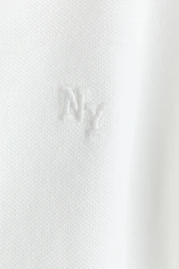Polo en piqué avec motif brodé