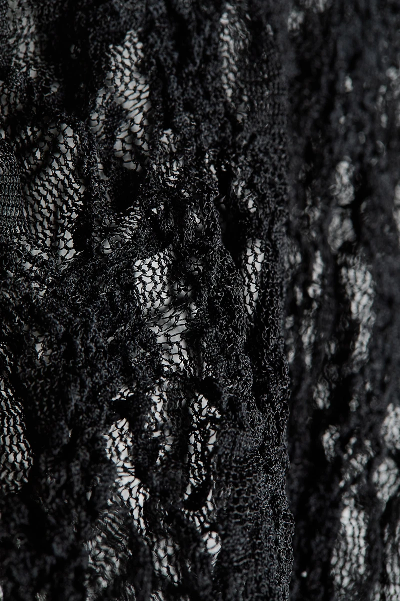 Haut en dentelle avec encolure V