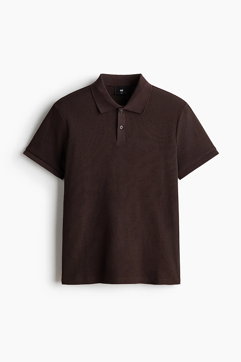 Polo près du corps en tricot gaufré