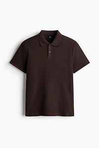 Polo près du corps en tricot gaufré