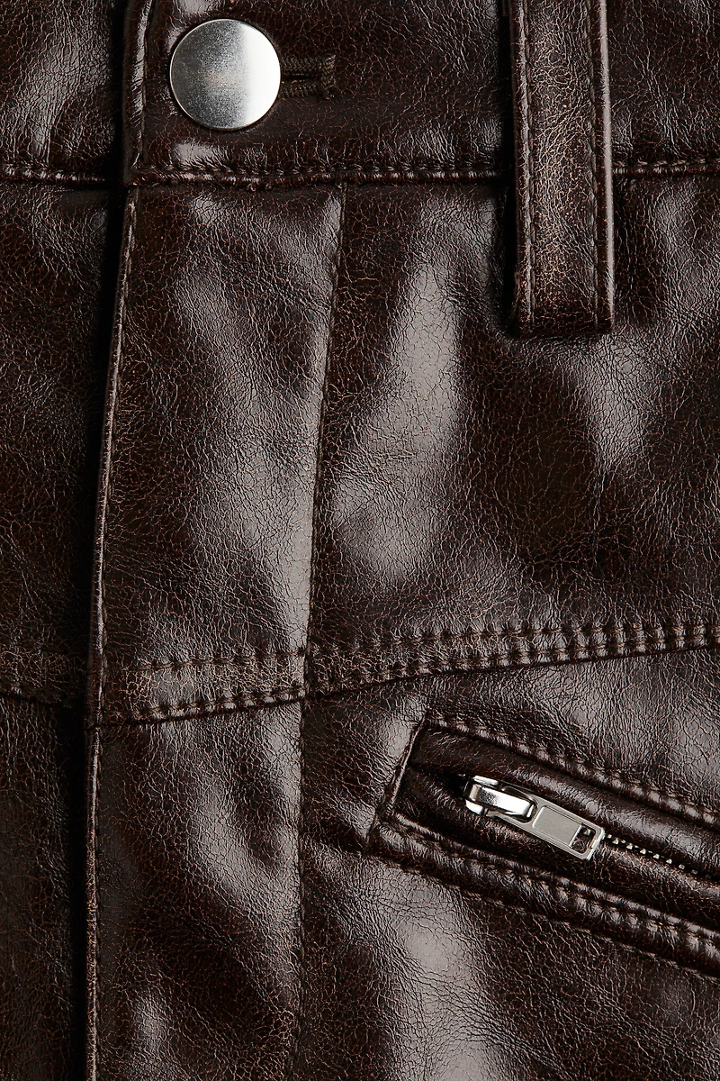 Mini jupe en tissu enduit