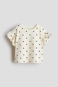 Haut à manches volants