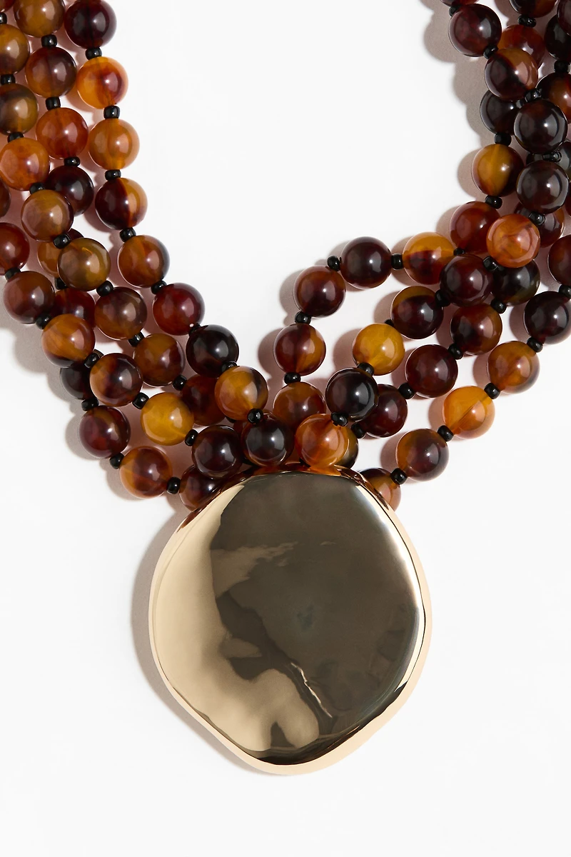 Collier de perles de fantaisie avec pendentif