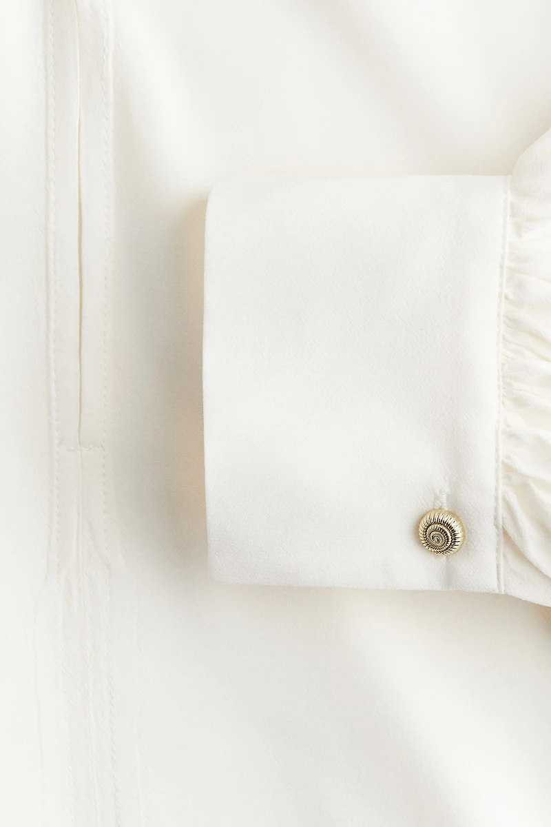Blouse volantée avec cordon de serrage