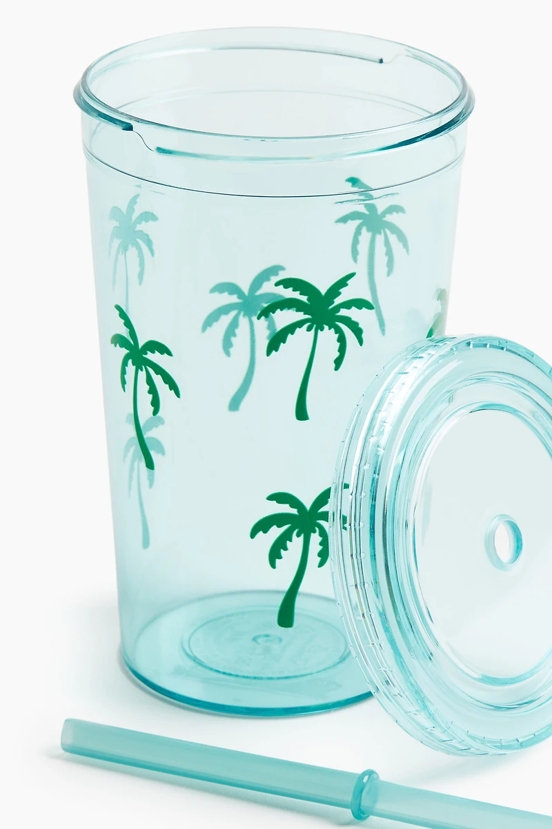 Gobelet en plastique à motif avec paille