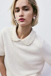 Haut en tricot avec col orné de perles fantaisie