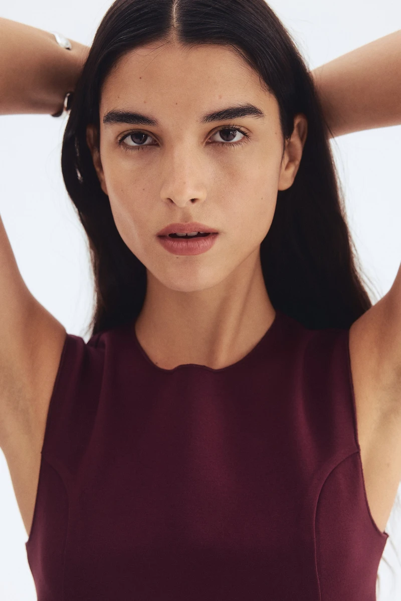 Interlock Sleeveless Peplum Top