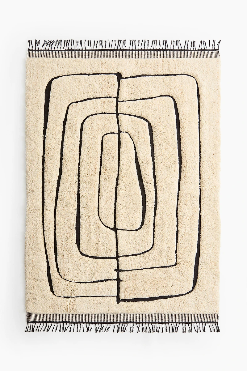 Grand tapis à franges en laine mélangée