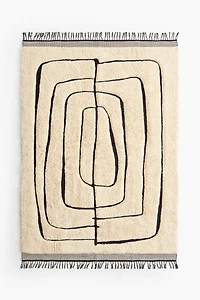 Grand tapis à franges en laine mélangée