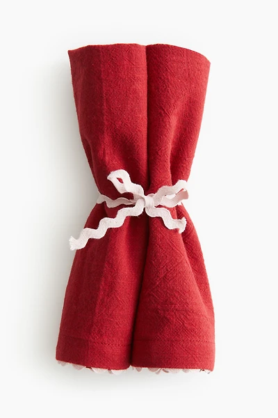 Lot de 2 serviettes table à bords festonnés