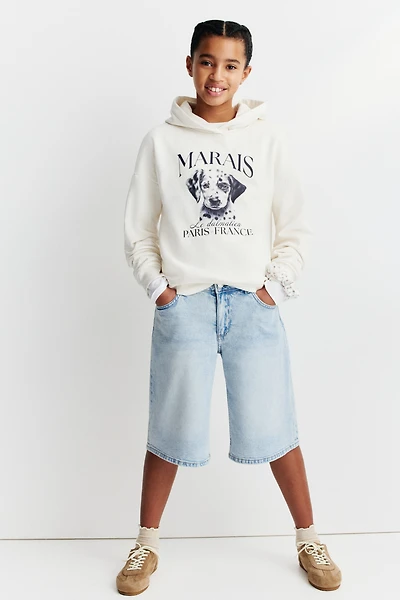 Short taille basse en denim aux jambes larges