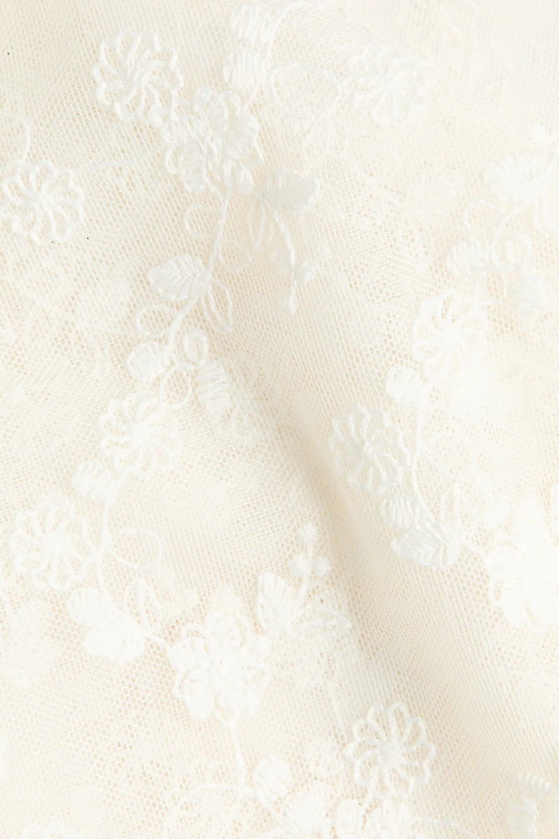 Foulard de hanches en filet brodé