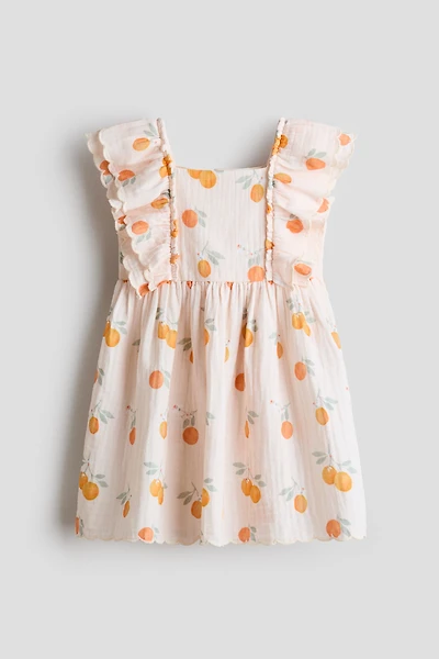 Robe à bords festonnés