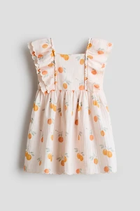 Robe à bords festonnés