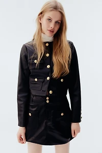 Veste en tissu enduit