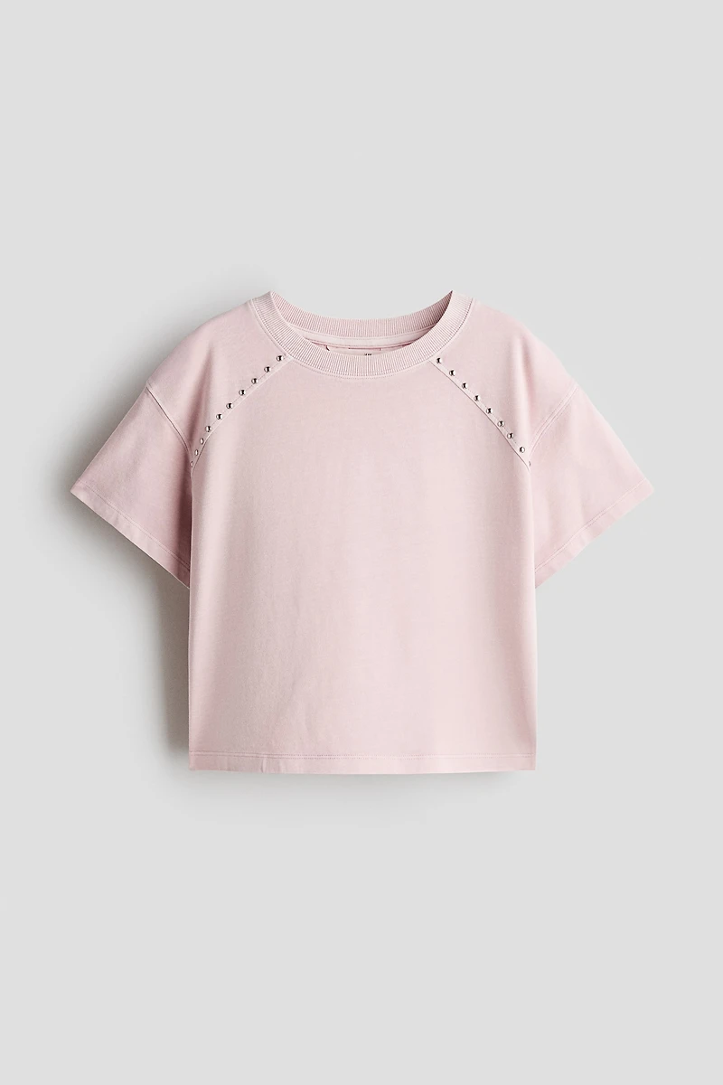 Haut clouté à l'aspect délavé