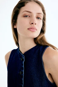 Gilet sans manches avec basque