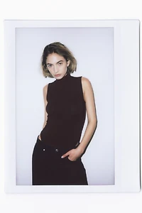 Maillot string à effet drapé