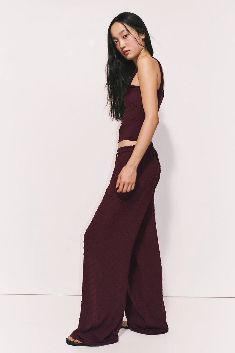 Pantalon en plumetis avec cordon de serrage