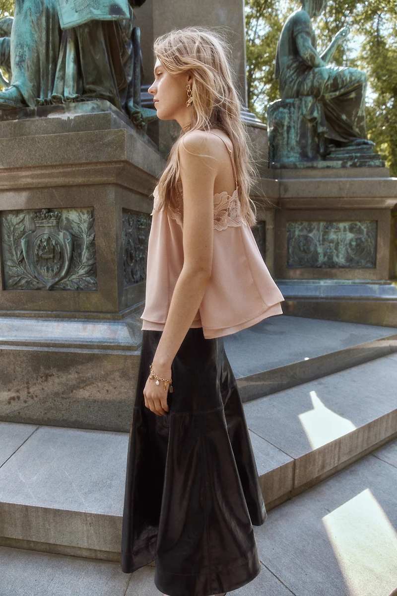 Jupe corolle en tissu enduit