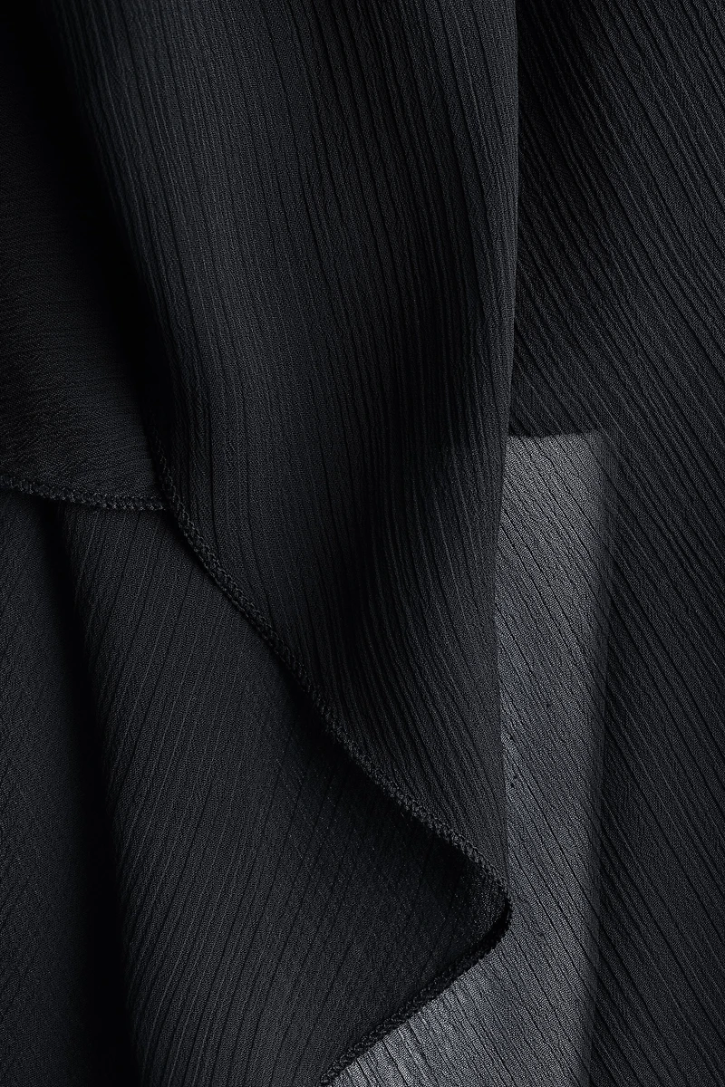 Blouse en mousseline avec détail d'aspect cape