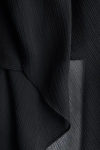 Blouse en mousseline avec détail d'aspect cape