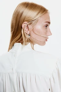 Blouse à épaulettes