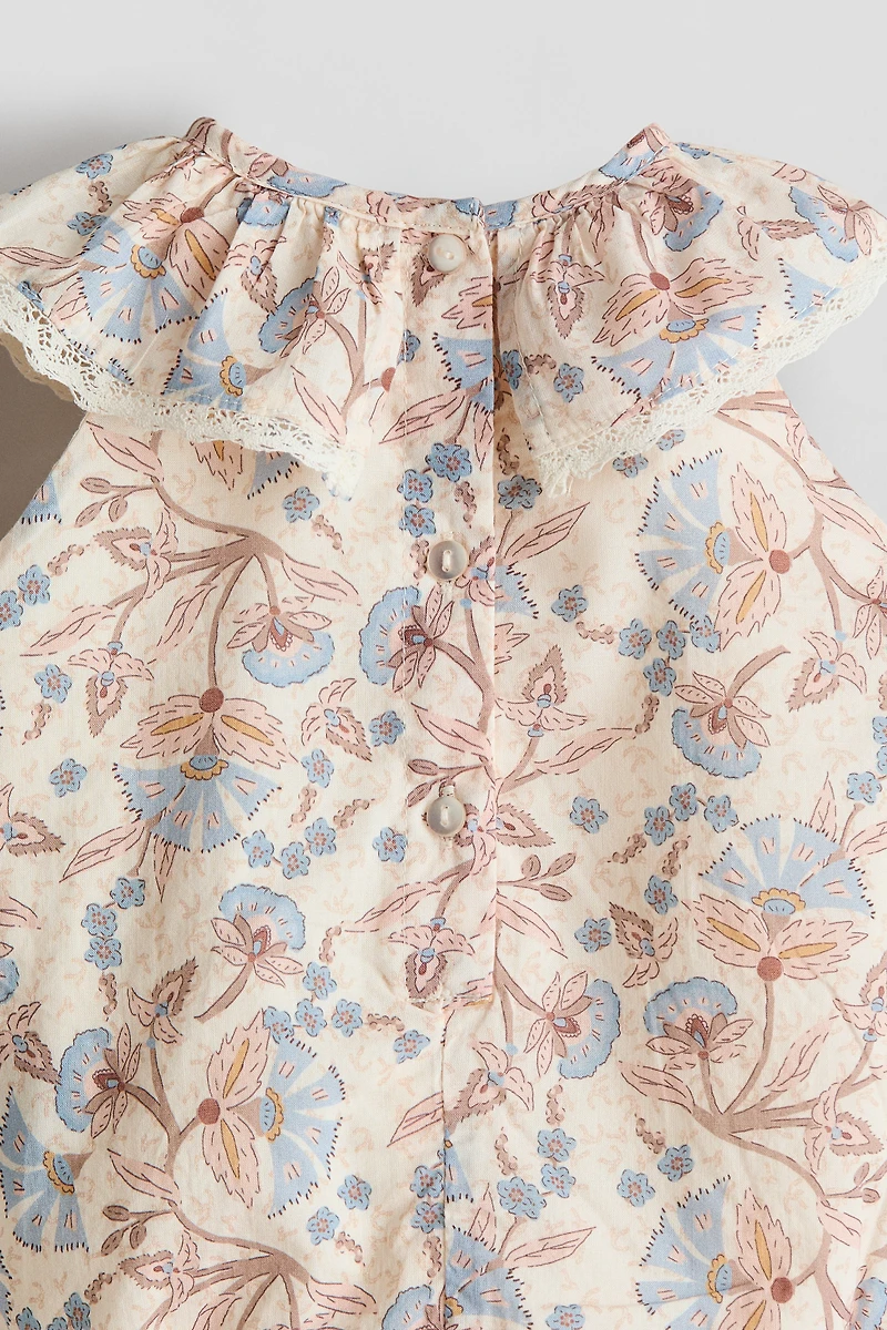 Barboteuse avec broderie anglaise