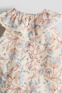 Barboteuse avec broderie anglaise