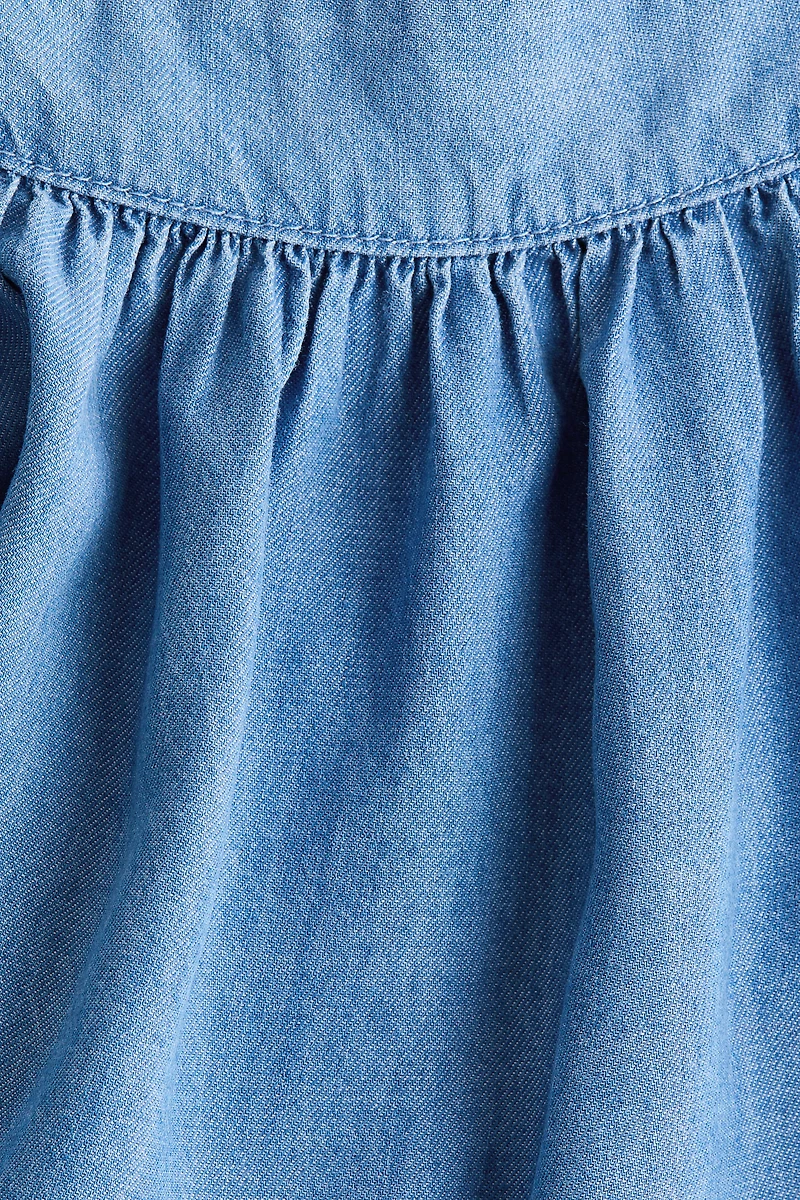 Blouse en denim avec manches bouffantes