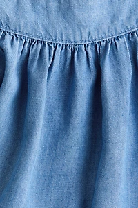 Blouse en denim avec manches bouffantes