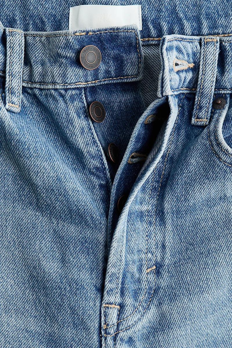 Jean tonneau en haut de la cheville