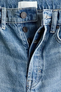 Jean tonneau en haut de la cheville