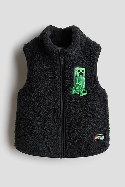 Veste sans manches en polar avec motif