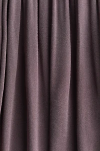 Pantalon à effet drapé avec ceinture nouer