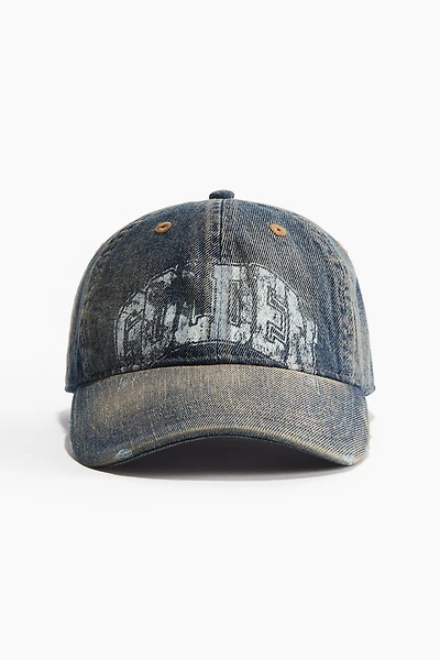 Casquette avec détails fortement usés