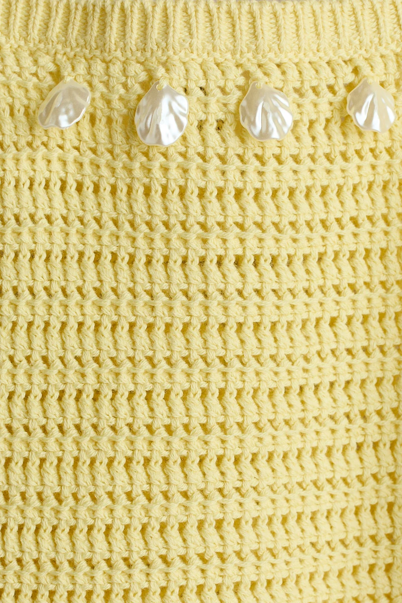 Haut ornementé en tricot