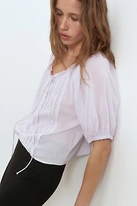 Blouse à plis nervurés