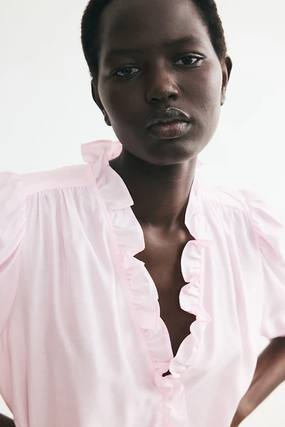 Blouse à volant manches bouffantes