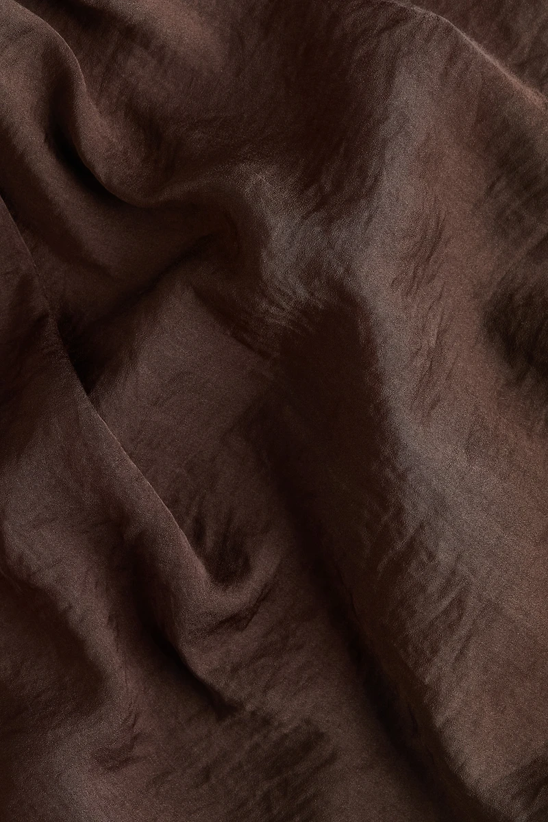 Haut dos nu en satin